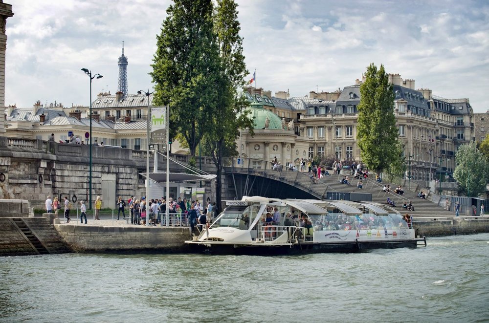 river seine hop on hop off tour at a stop in paris