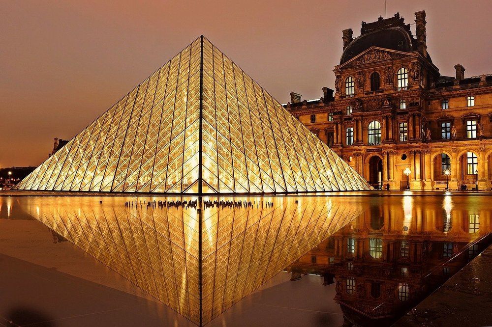the louvre lighted up at dusk