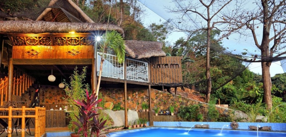 wooden beach house next to pool