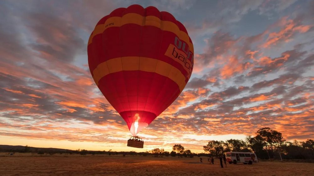 Start your day right with a hot air balloon ride over Alice Springs.