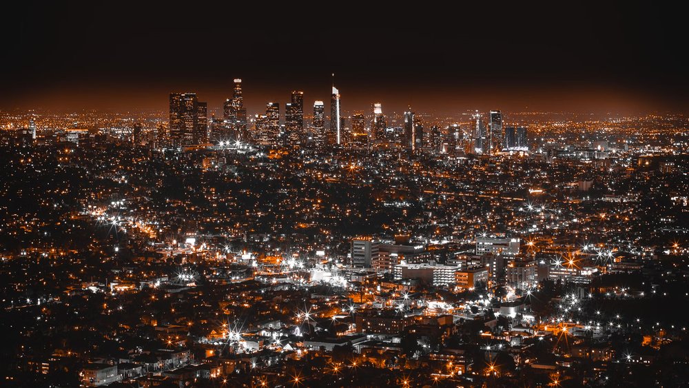 See the famous LA landmarks lit at night and the glimmering lights of the city!