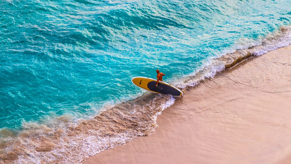  Whether you’re a pro or catching a wave for the first time, Waikiki is the place to be!] [Image credits @Nakul on Unsplash