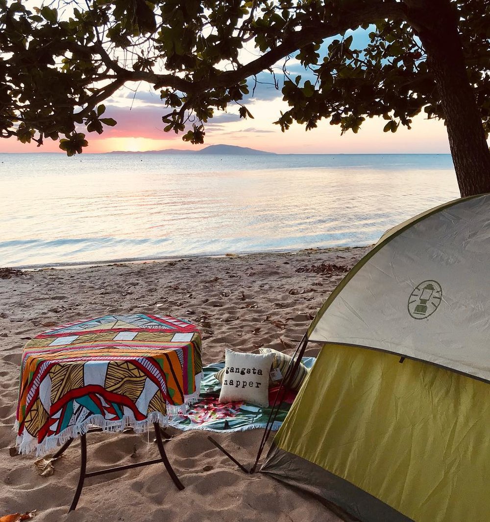 tent and table in front of beach