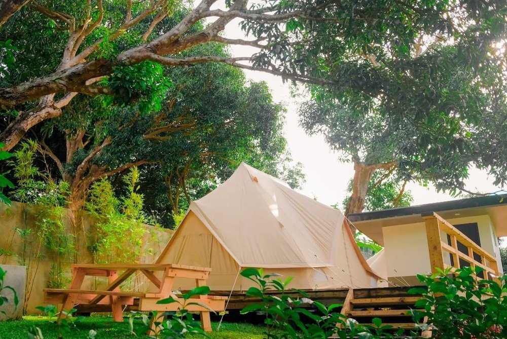 beige tent on wooden platform