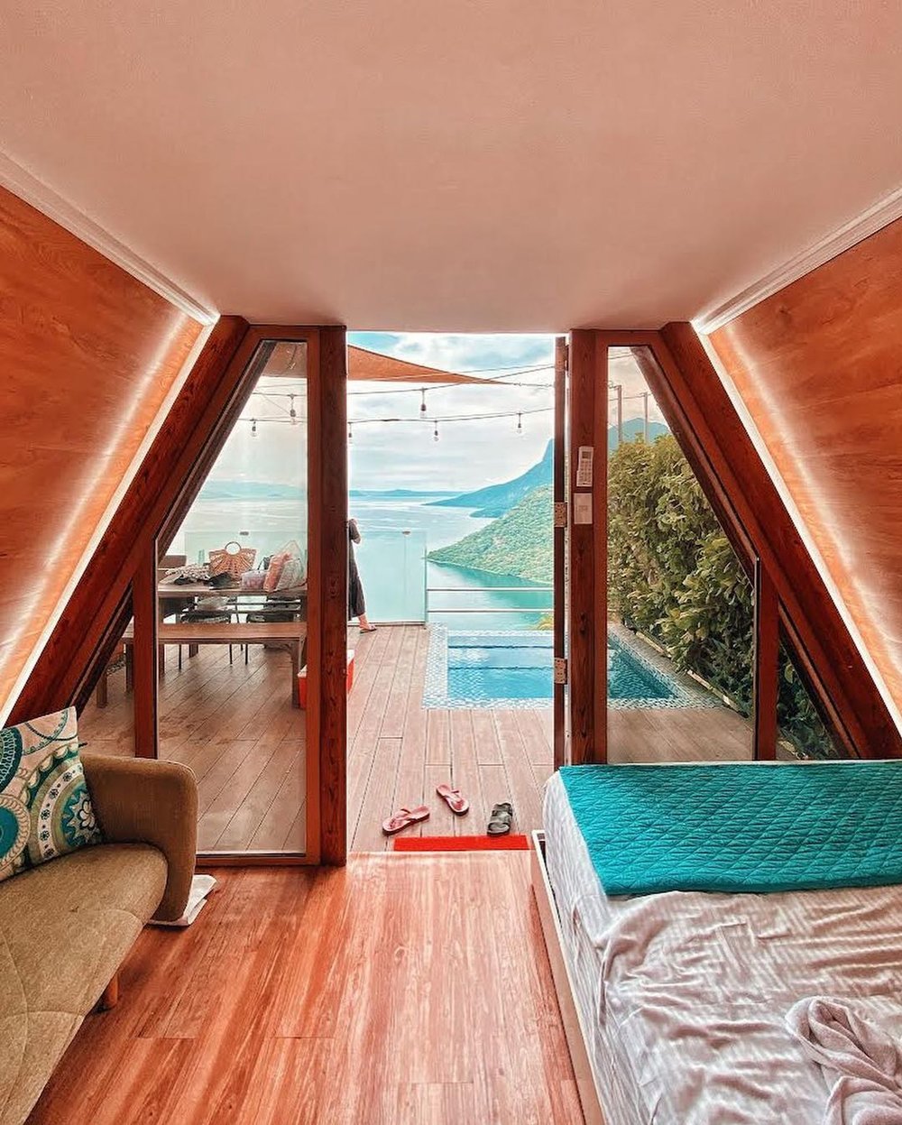 glass door of triangular villa with view