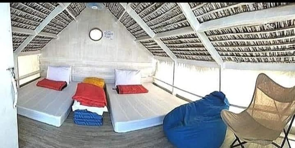 villa with sleeping mattresses and chair