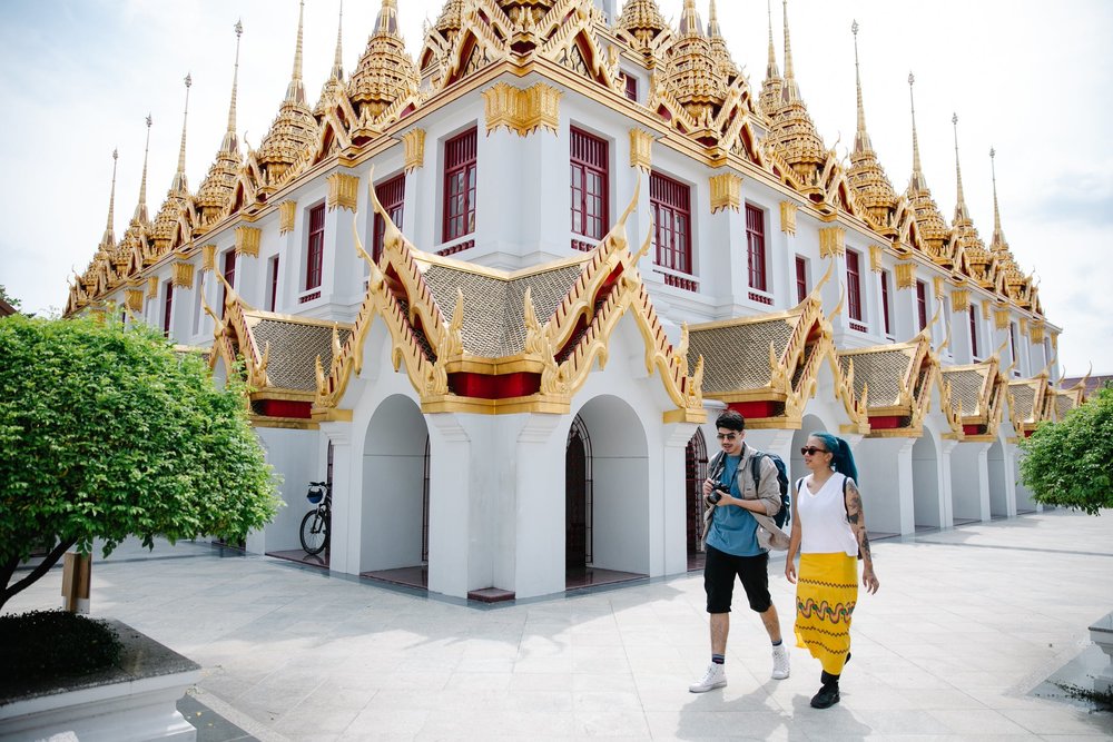 Tourists walking near an attraction in Thailand