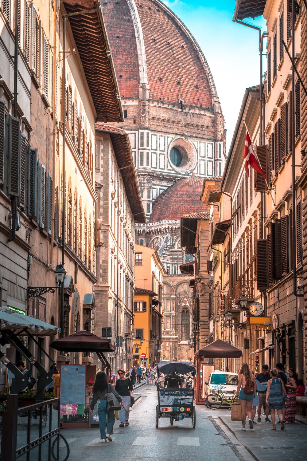 people walking through the busy streets in florence italy