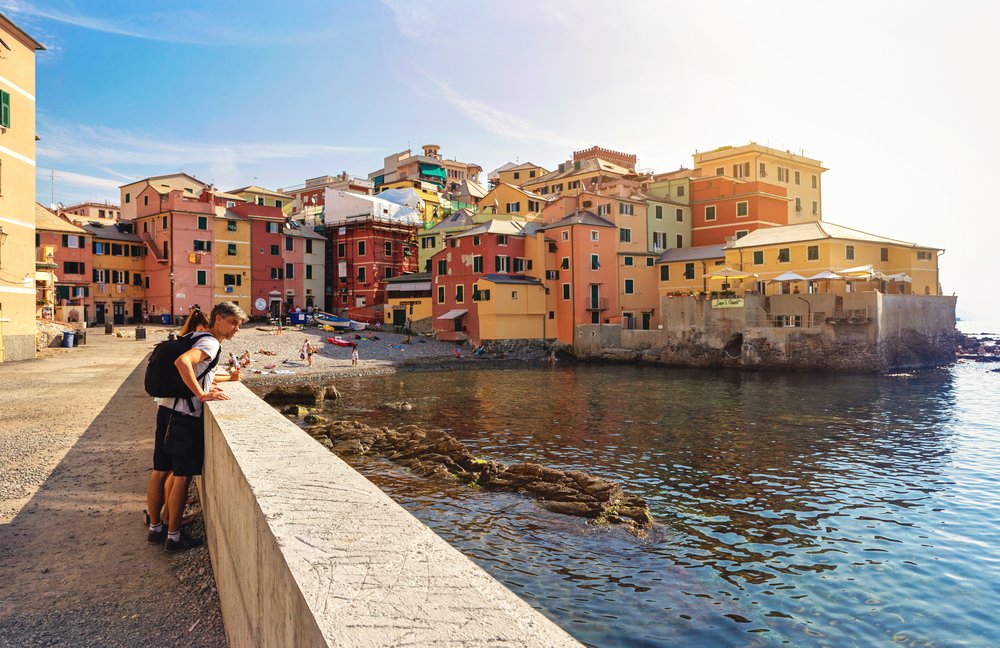 a man admiring the ocean waters at genoa italy
