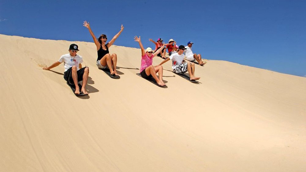 Have fun under the sun at the largest coastal sand dunes in Australia. Credit: portstephens4wdtours