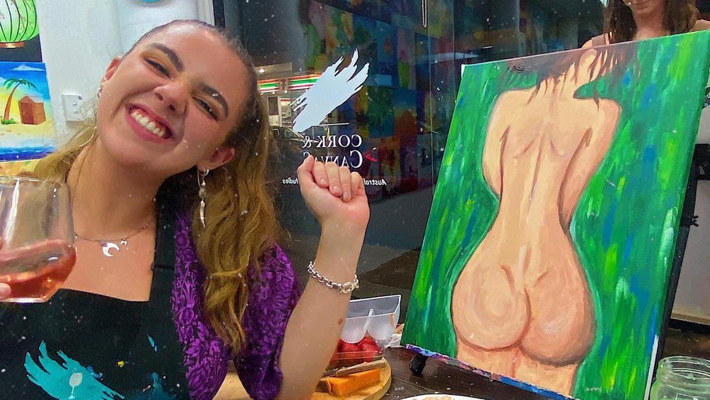 Paintbrush on one hand and a glass of champagne on the other! Image Credits: @hannahjanelonsdale
