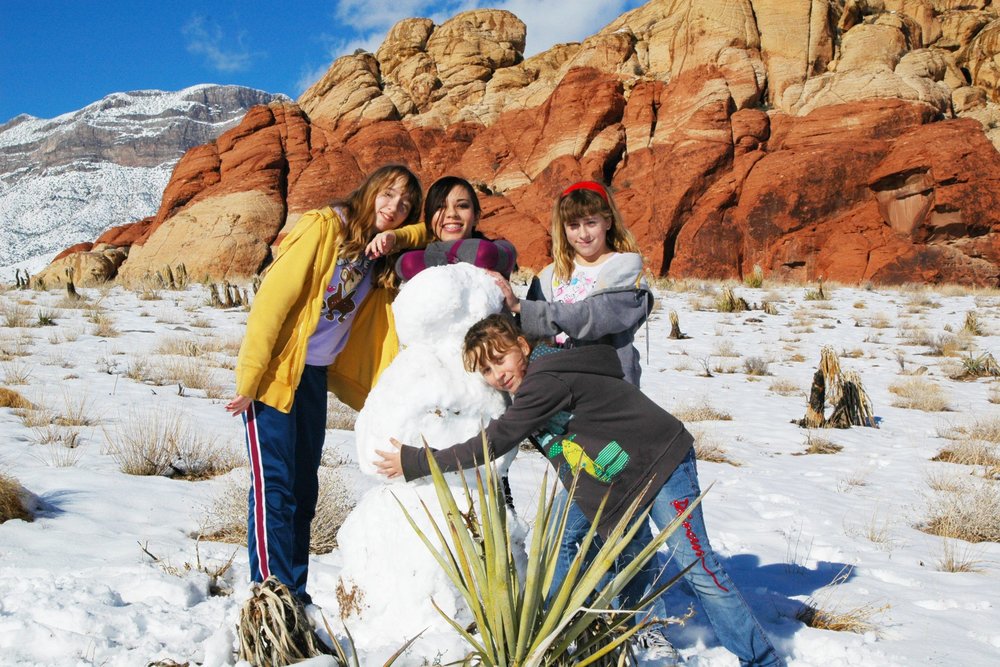 kids with a snowman at red rock canyon