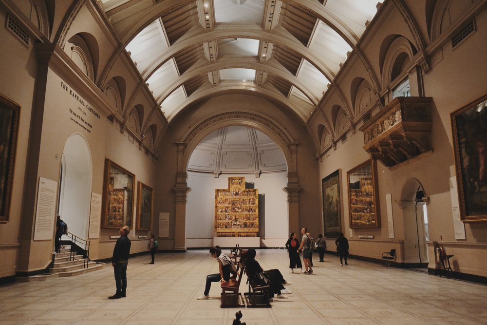 a group of people visiting the victoria and albert museum in london uk