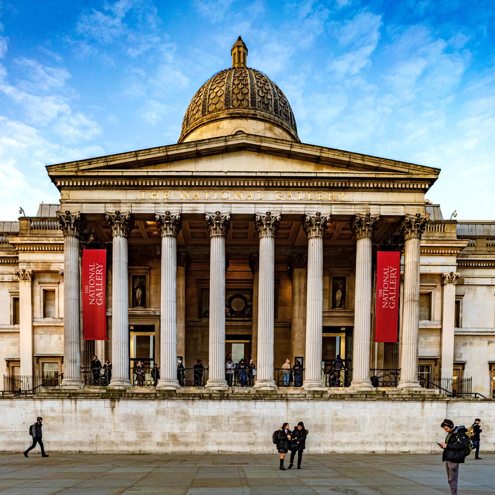 visitors in front of the national gallery london uk