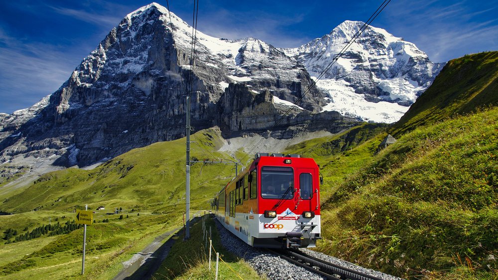 Discover the Swiss Alps through a scenic train ride—included in your Eurail Pass. Credit: Piotr Guzik