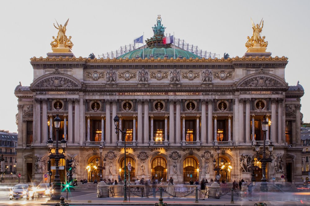 the facade of the palais garnier at night, paris france