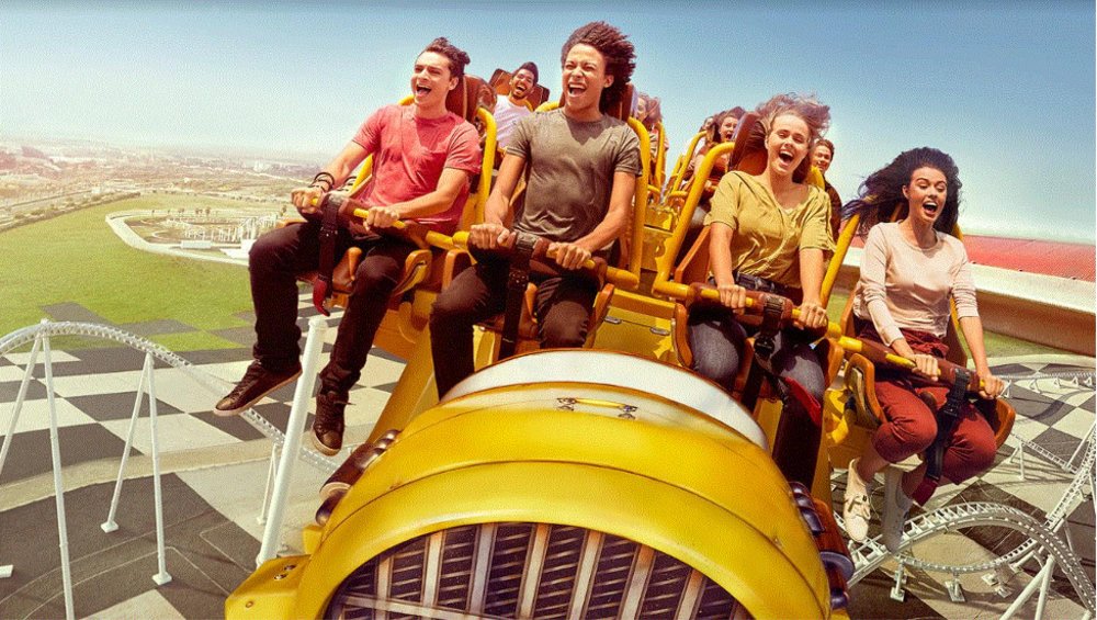 group of people riding roller coaster in the highest loop