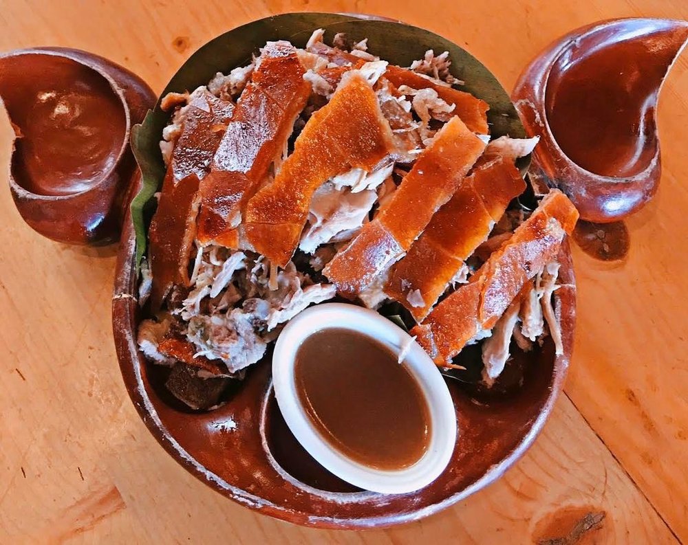 lechon in wooden plates
