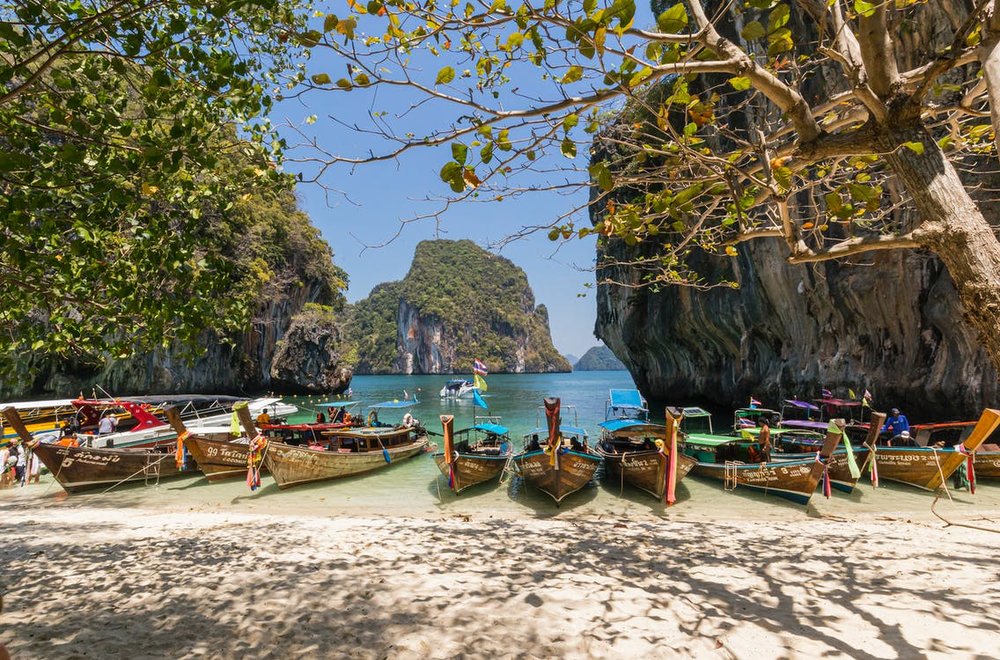 boats in the shore at the beach