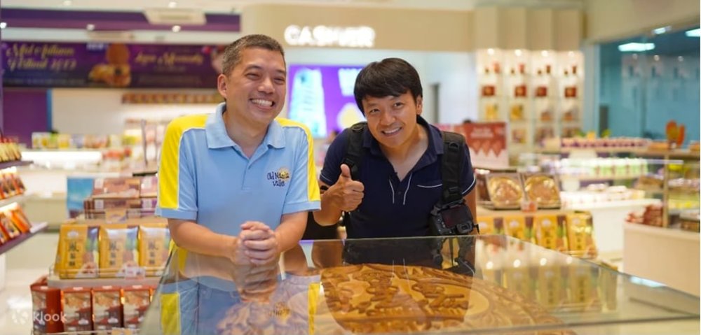 two man inside the store smiling