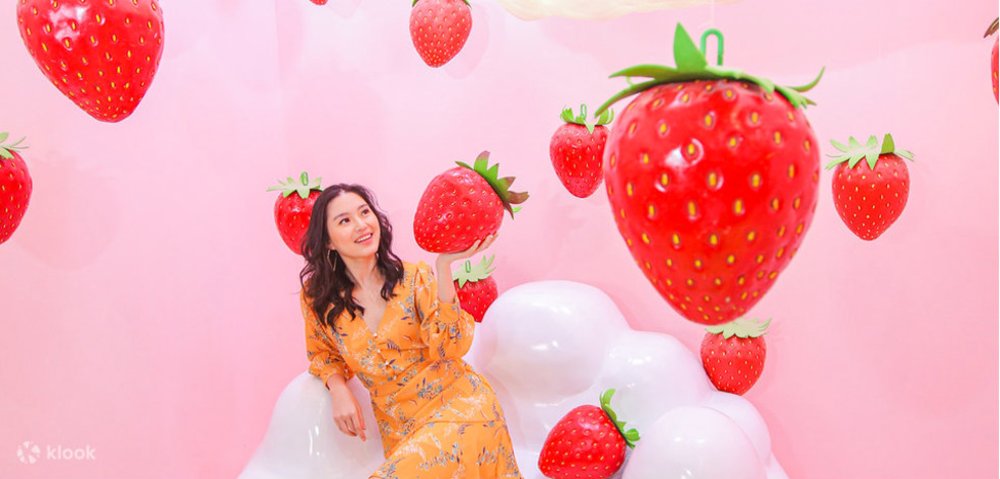 Girl iaround big gigantic strawberries