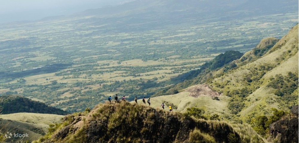 group of hikers traversing the mountain