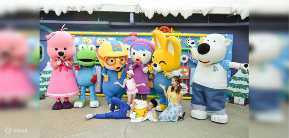 Group of people taking group photo with pororo characters