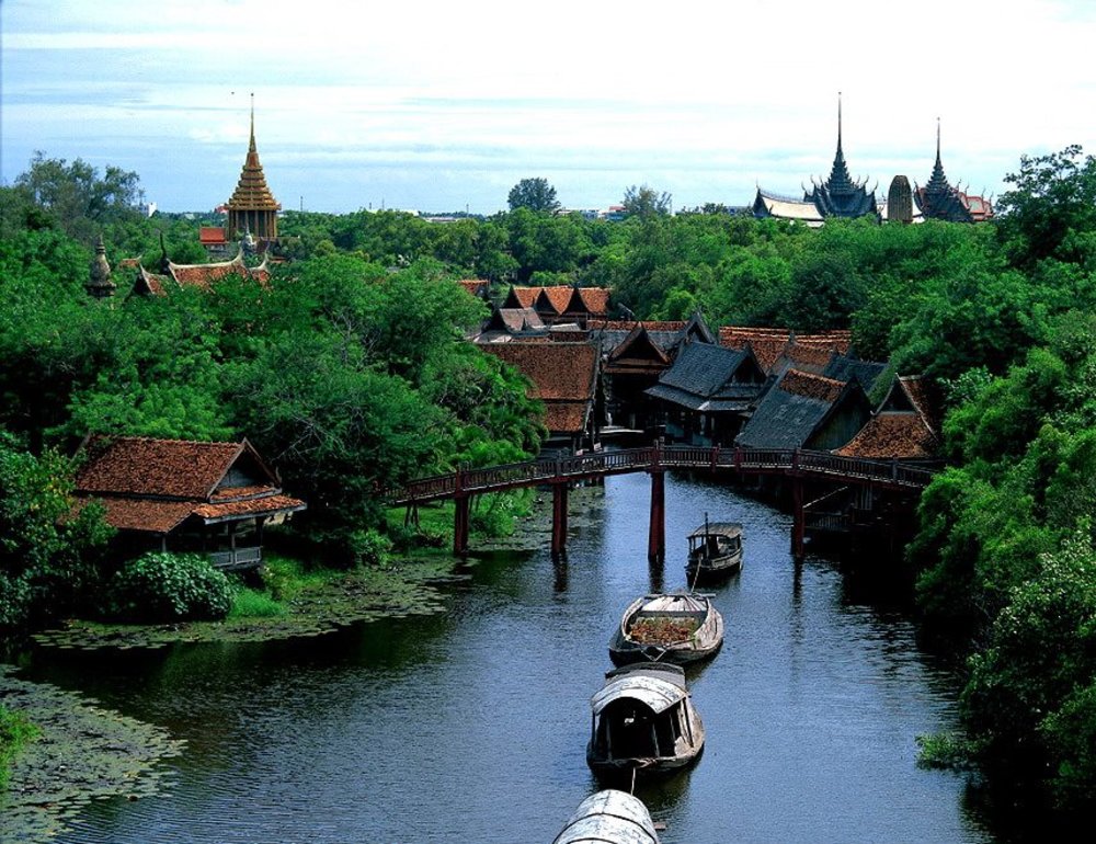 Boat cruising the River in a green forest