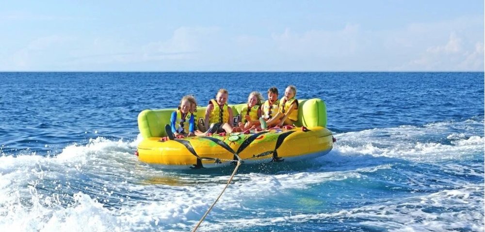 group of friends riding inflatables