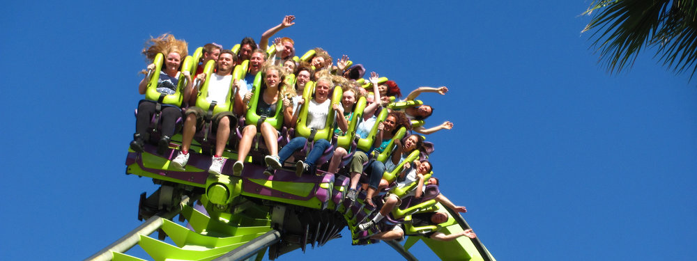 people on a rollercoaster mid air at six flags san francisco
