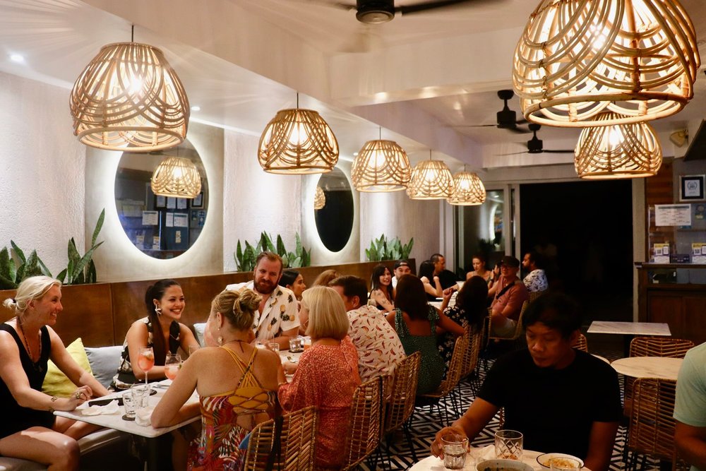Group of foreigns having fun at the dinner table