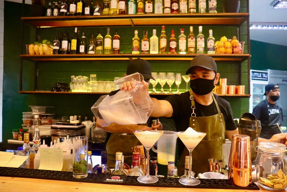 Bar tender pouring drinks
