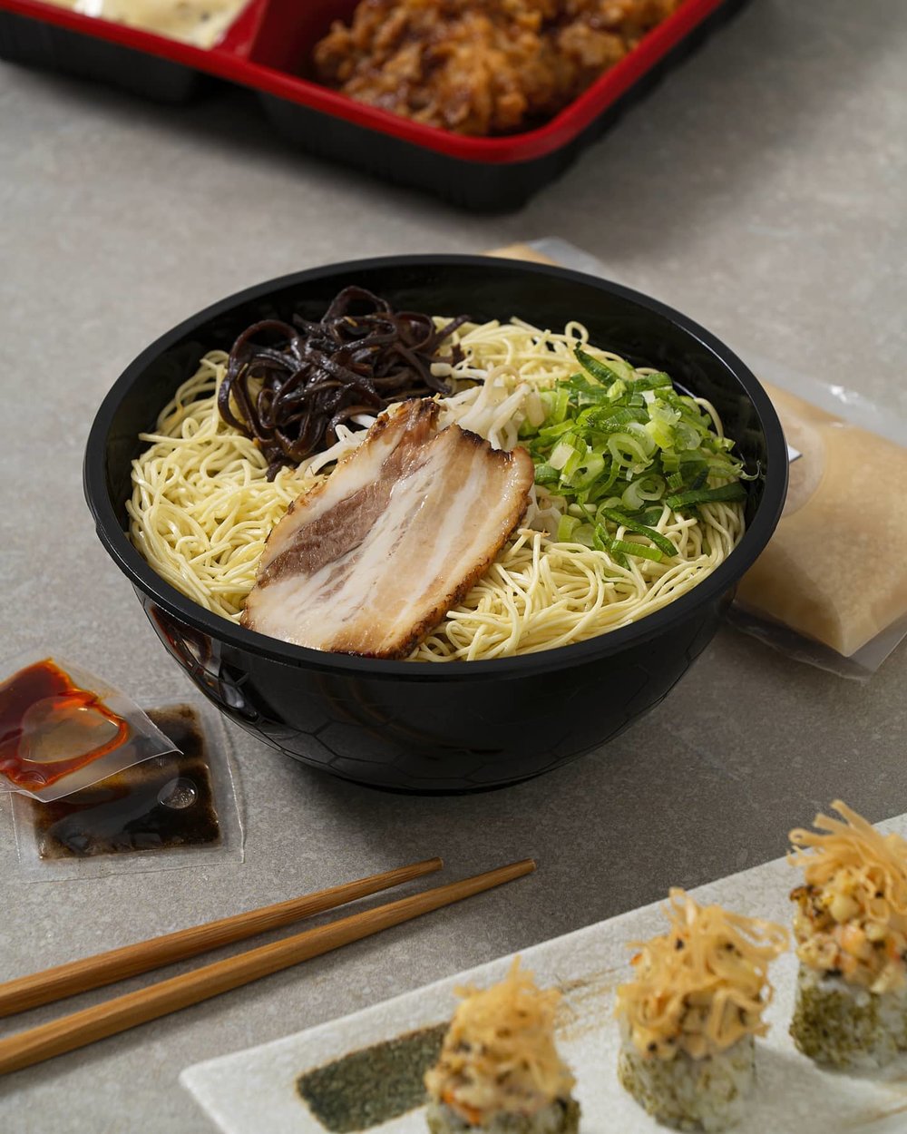 Bowl of noodles with pork and vegetables