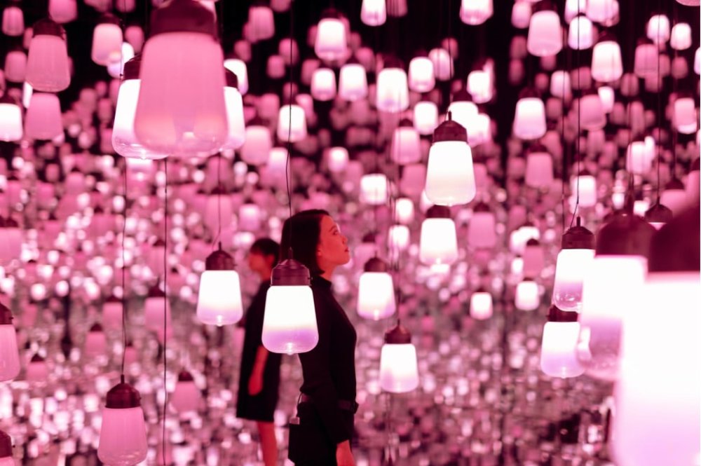 Girl in a room full of pink light