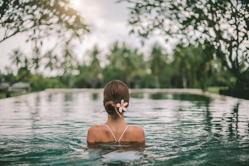 A woman in an infinity pool in Ubud, Bali