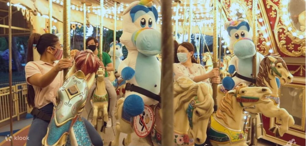 Group of people riding a corousel