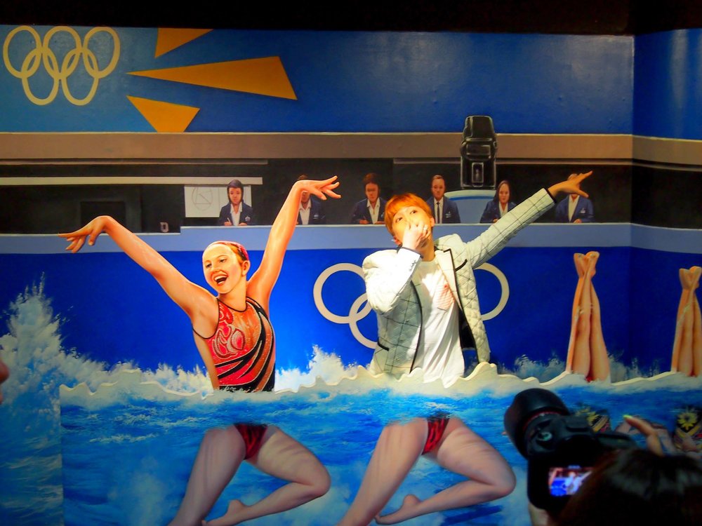 Tourist mimicking the swimmer