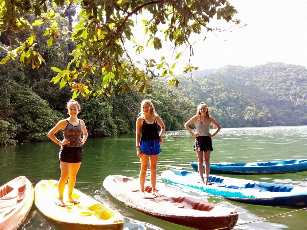 Girls standing in the kayak boat