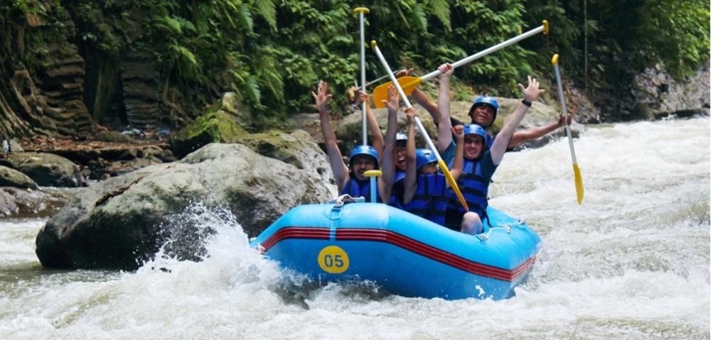 Group of men riding a boat in the river