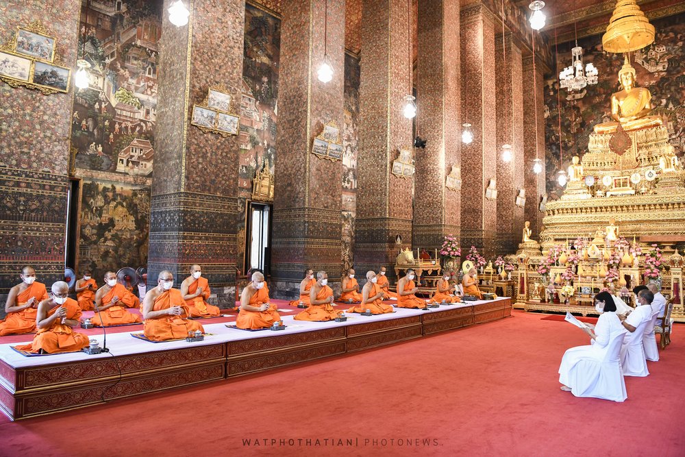 Monks praying inside the temple