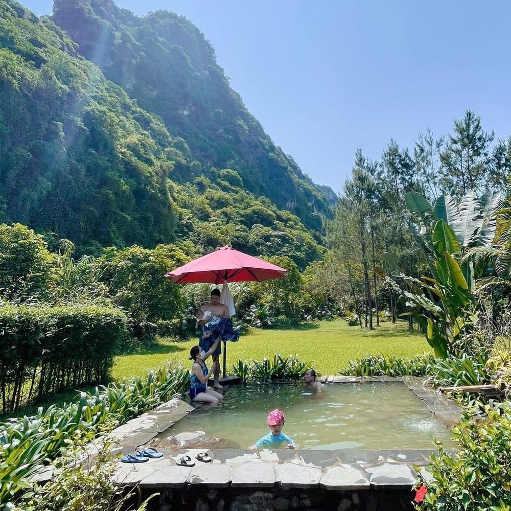 Family bathing in hot spring