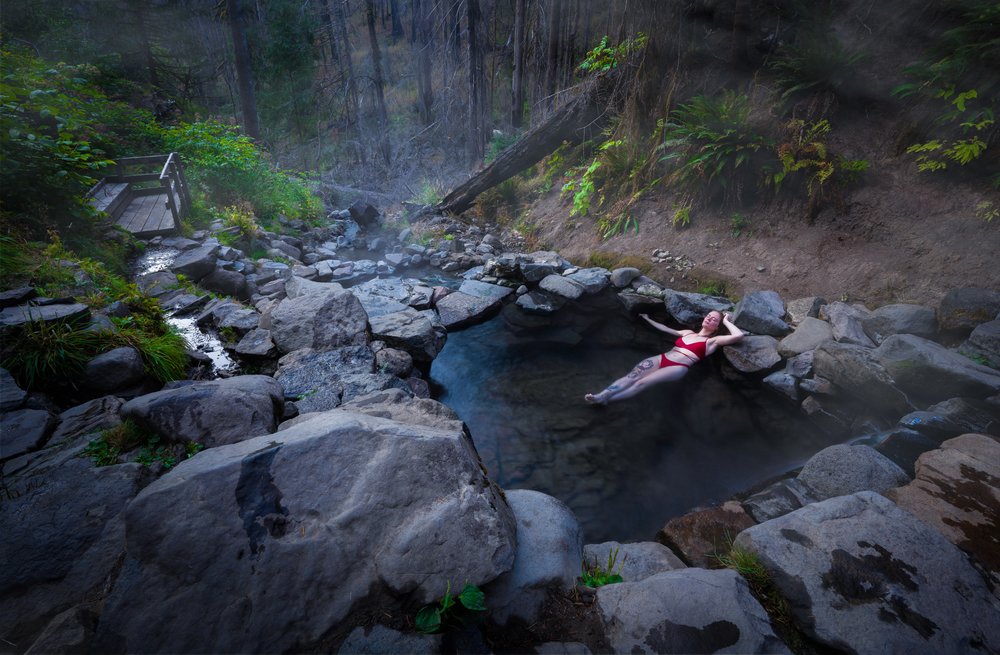 Girl in bikini relaxing in hot spring