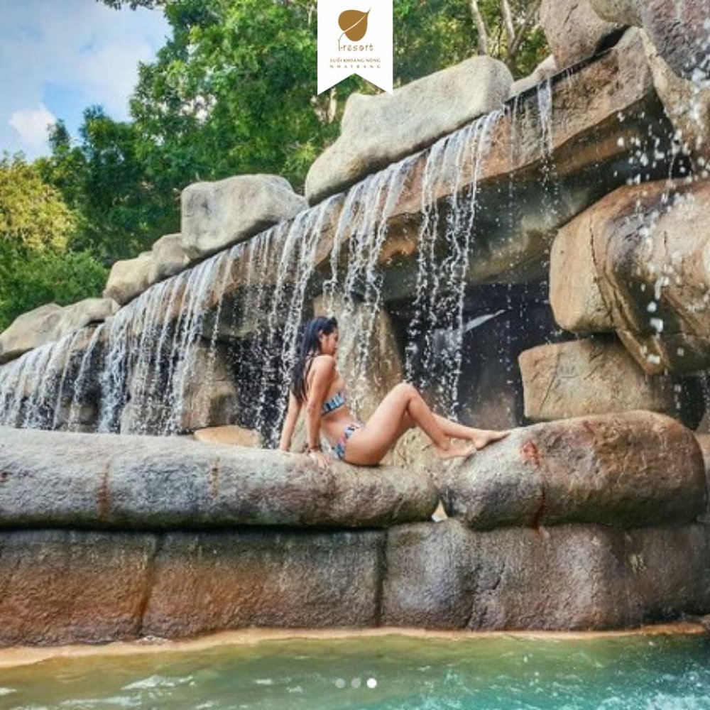 Girl in bikini bathing in hot spring