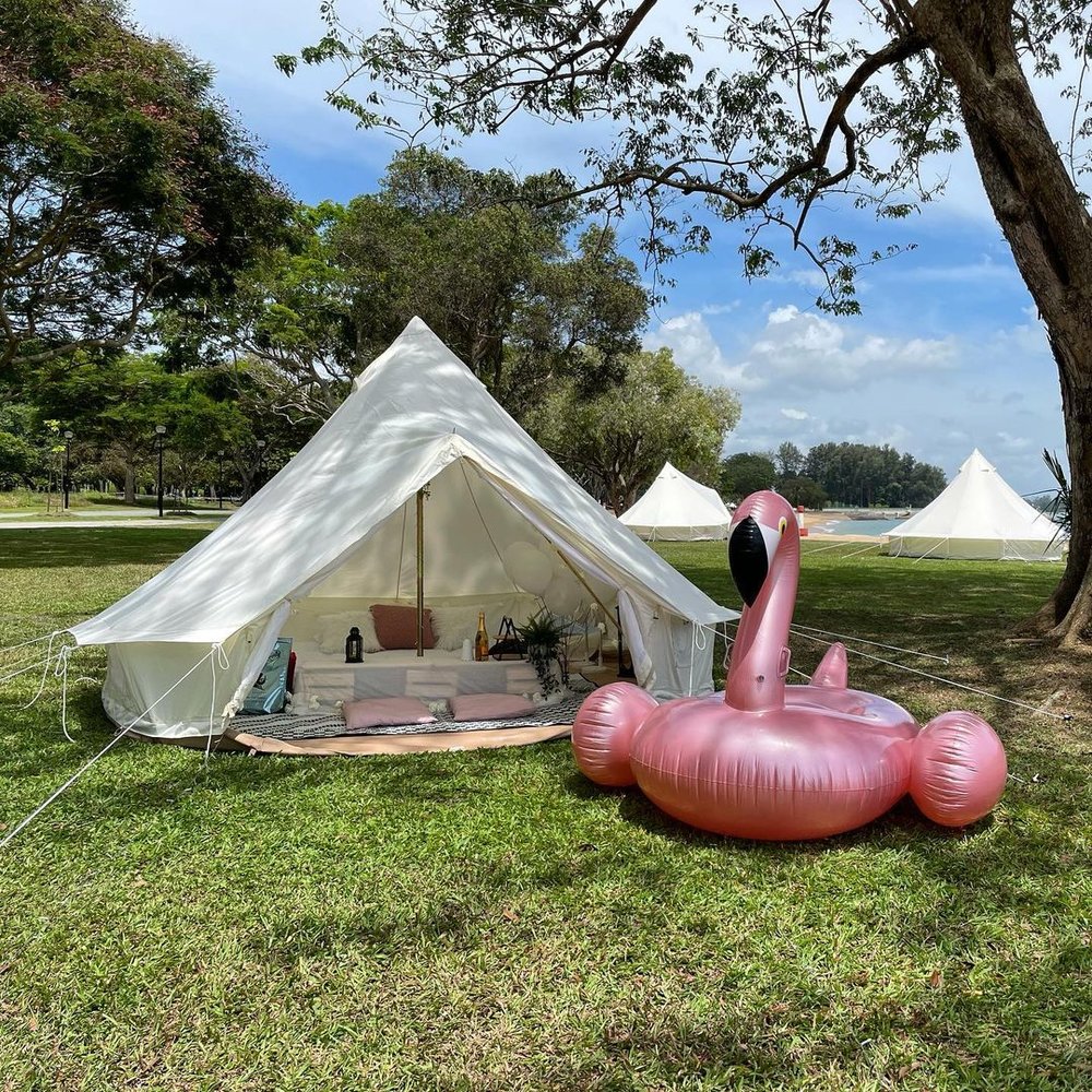 Glamping room beside a big flamingo floater 