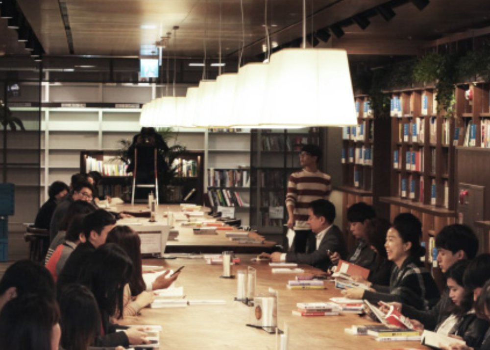 People in the store sitting and laughing