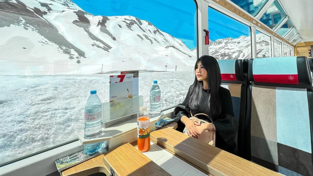 Ride the Glacier Express from Zermatt to St. Moritz for panoramic views of the snow-capped peaks