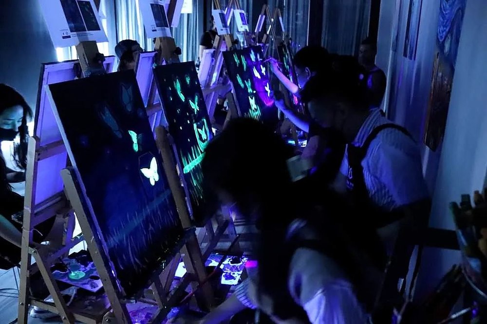 Glow in the dark Sip & Paint session best thing to do in KL at night
