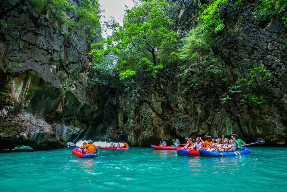 Tourists kayaking in the waters of Hong Island