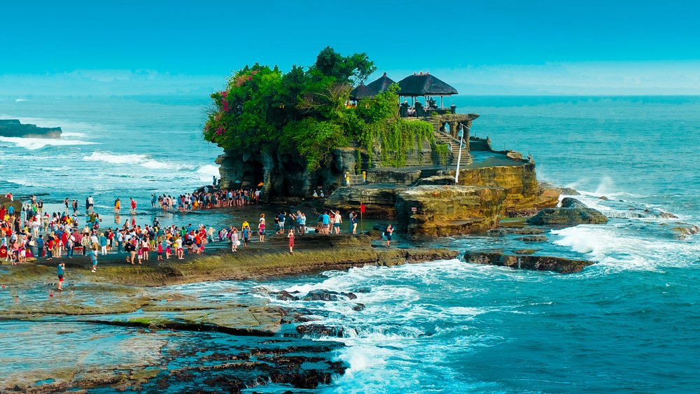 You can walk to the temple during low tide when the sandbar is visible.  Credits: Eyestetix Studio