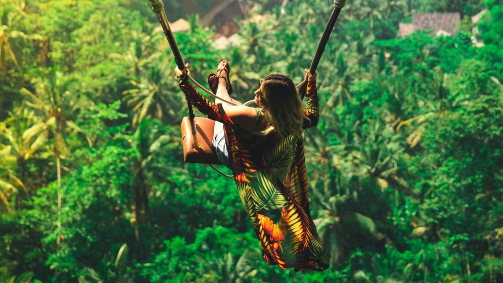 The weather in Bali is perfect for enjoying jungle swings: it’s hot enough for flowy summer clothes while still being breezy! Credits: Christopher Alvarenga on Unsplash